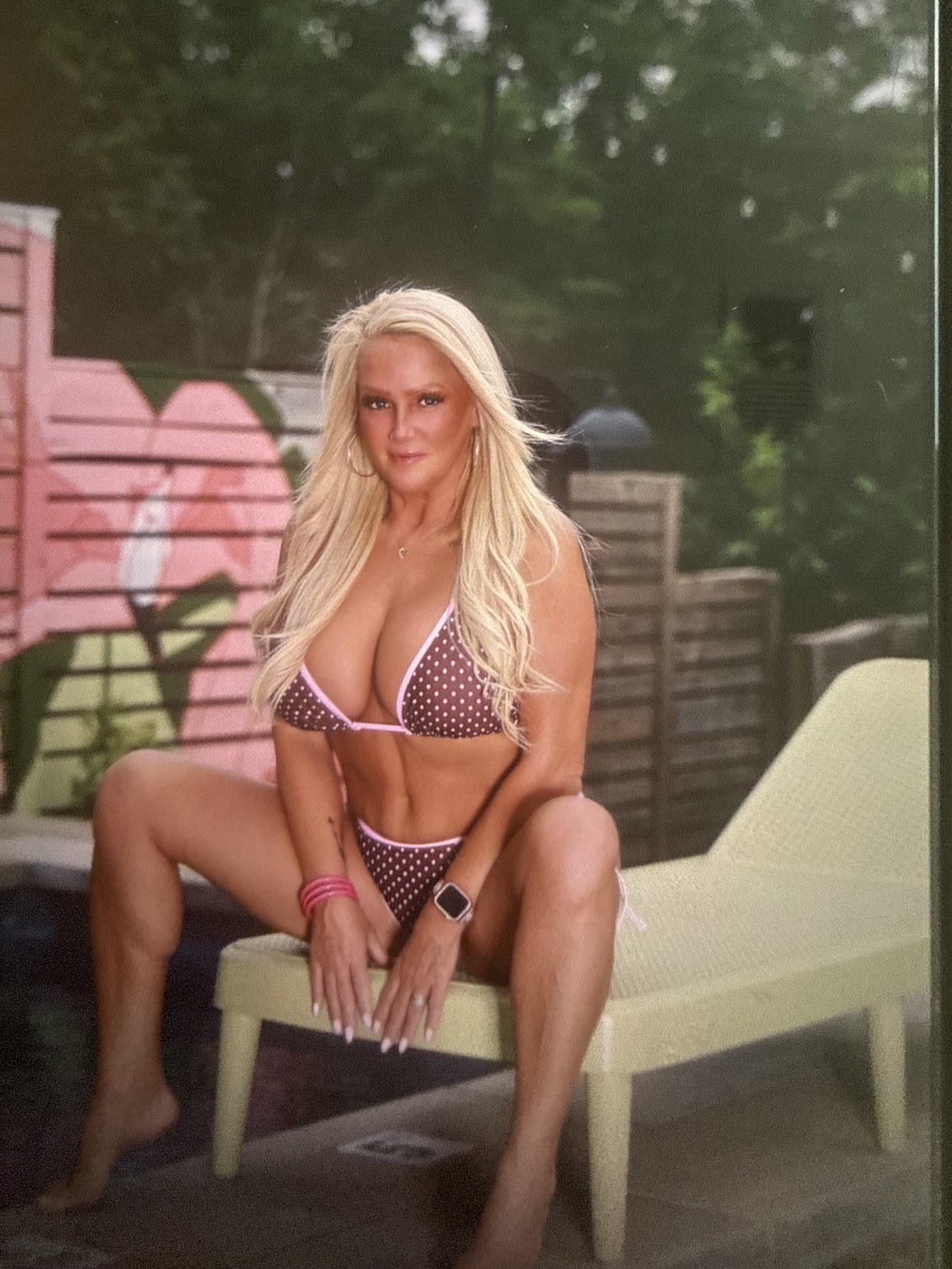 Daphne Love poolside in pink